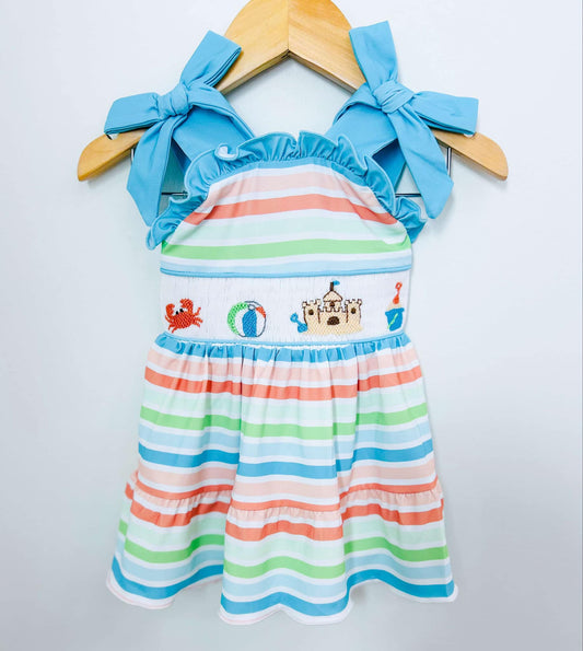 GIRL PLAYING AT THE BEACH SMOCKED DRESS